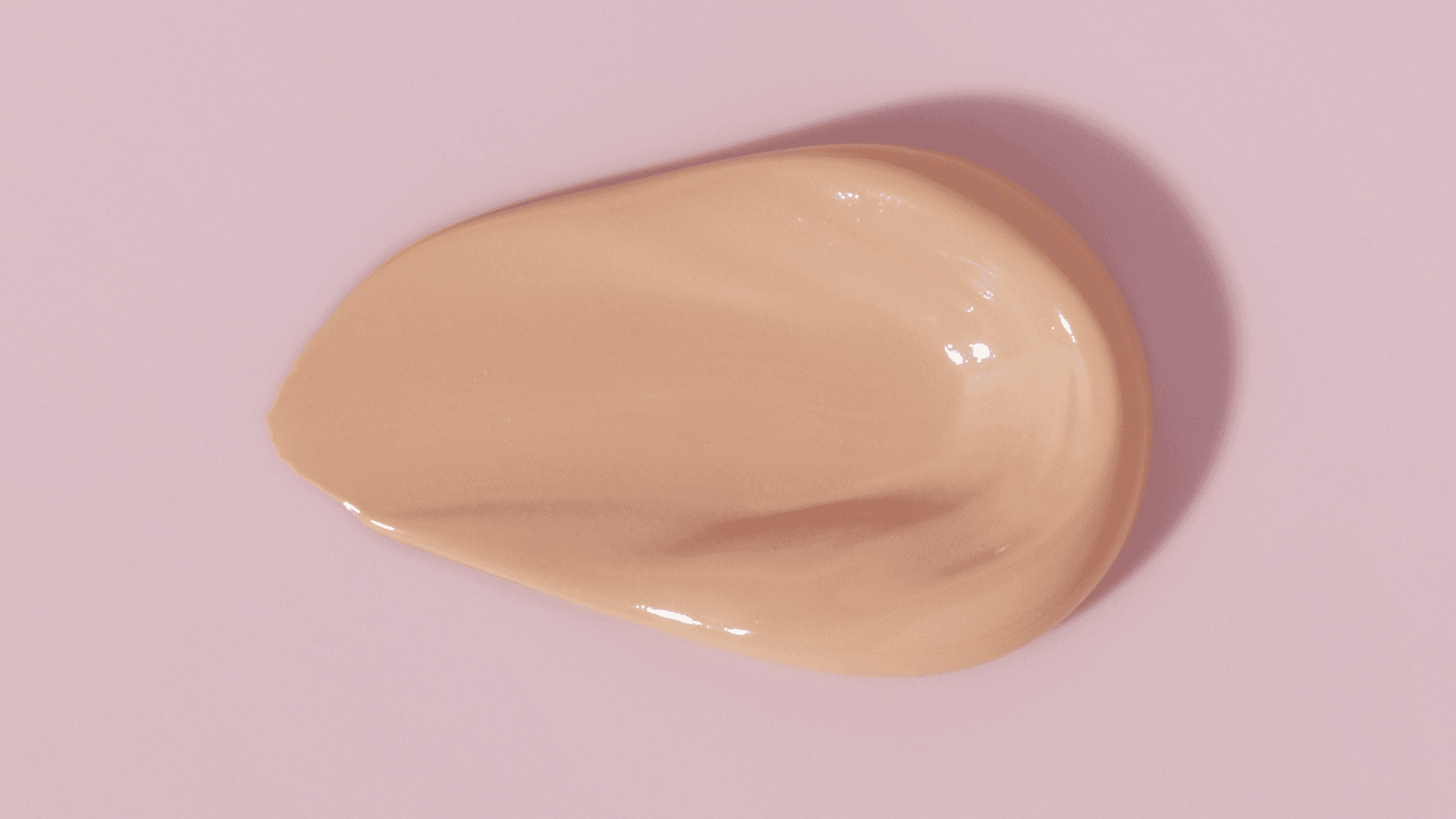 Beige cream on a light purple background