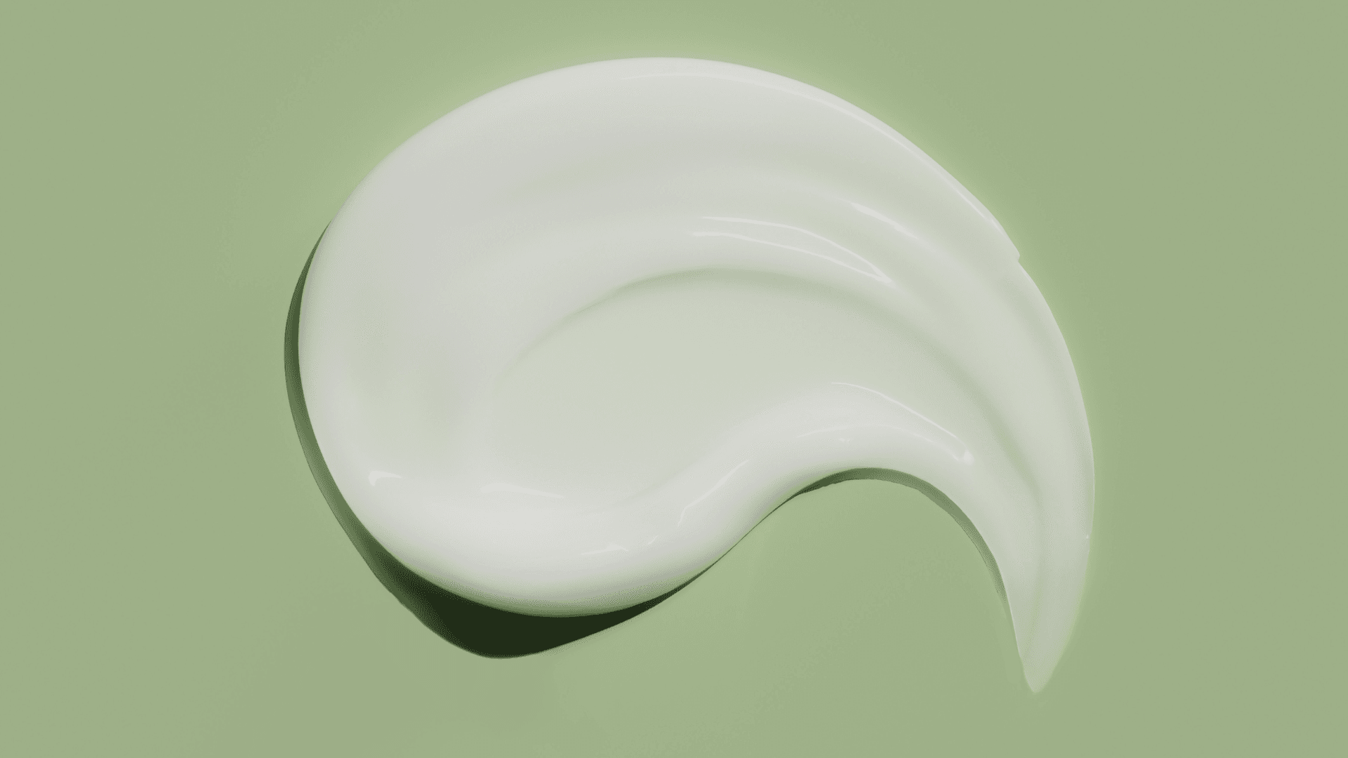 White cream on a green background