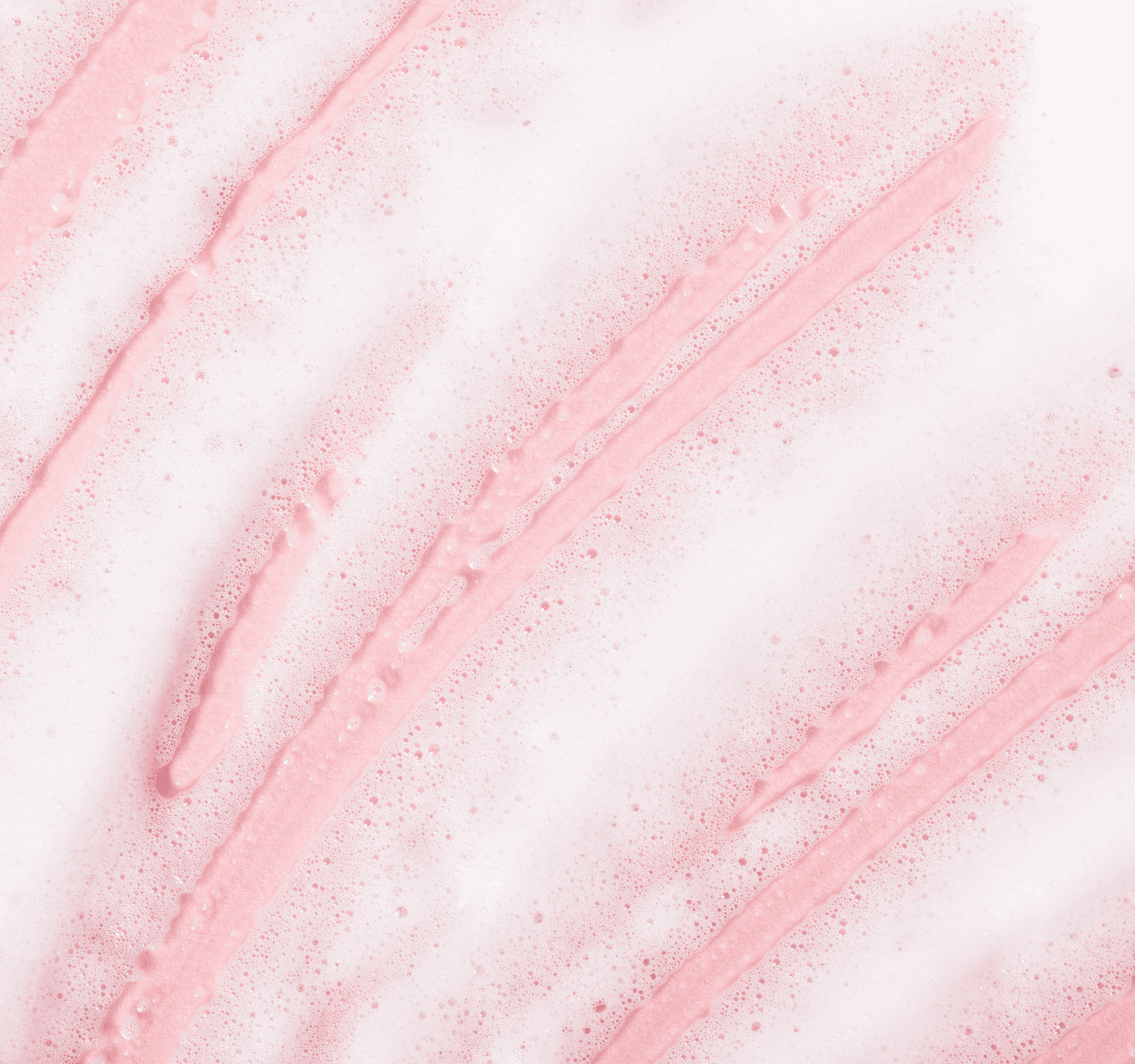 White foam on light pink background