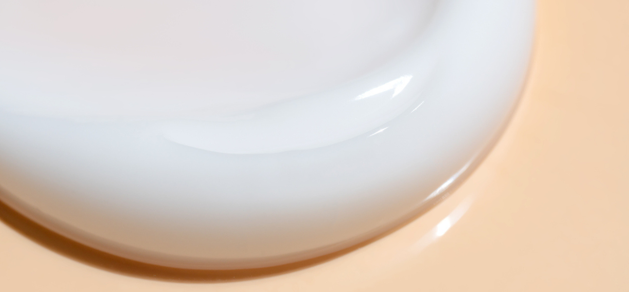 White cream on a peach background