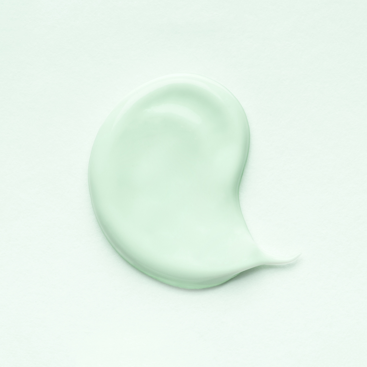 Pale green serum on a pale green background